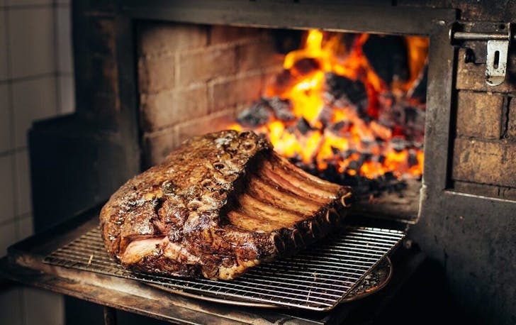 A piece of meat cooking from Burnt Ends