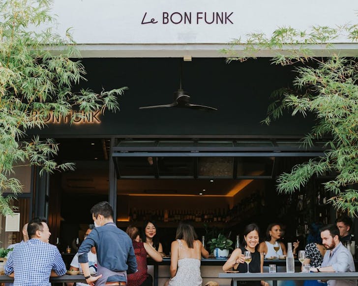 People sitting outside at wine bar