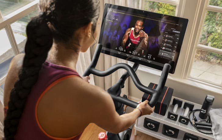 Person on Peloton bike.