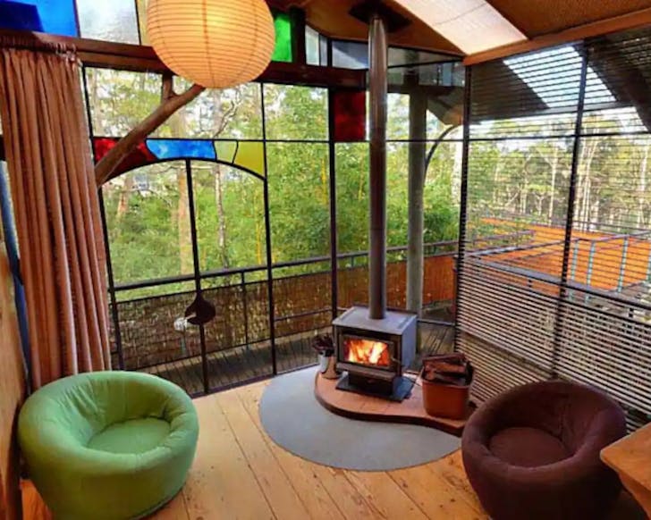 A lounge room with a fireplace