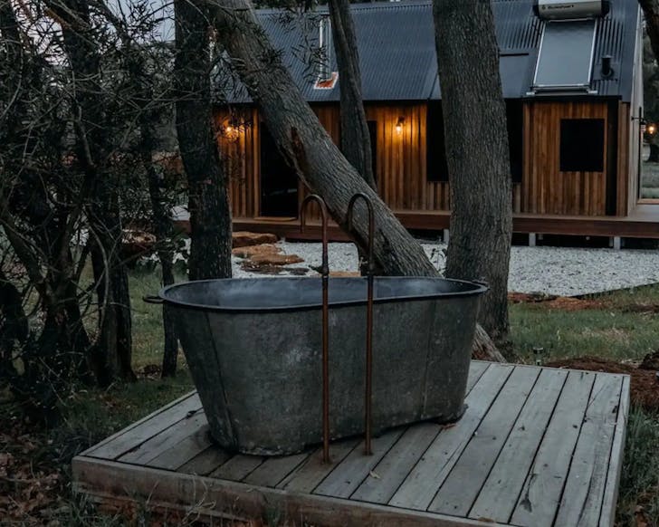 A rustic outdoor bath tub