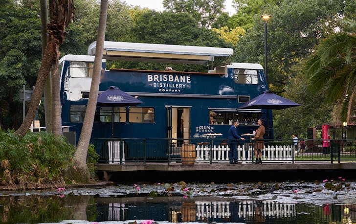a double decker bus in a garden