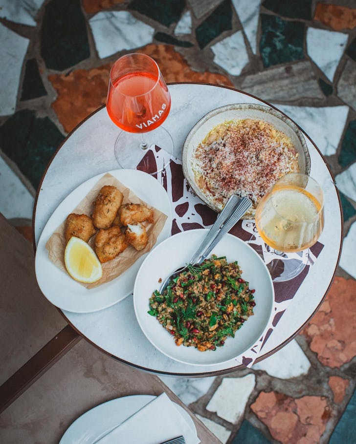 A table full of food at new restaurant Yiamas