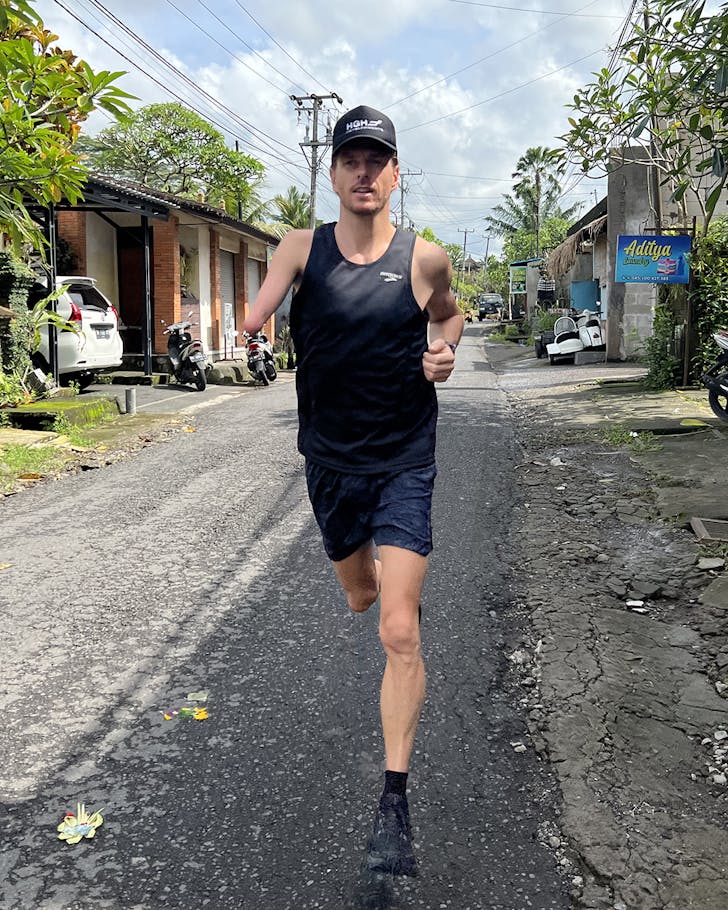 Michal Roeger running through the streets, abroad