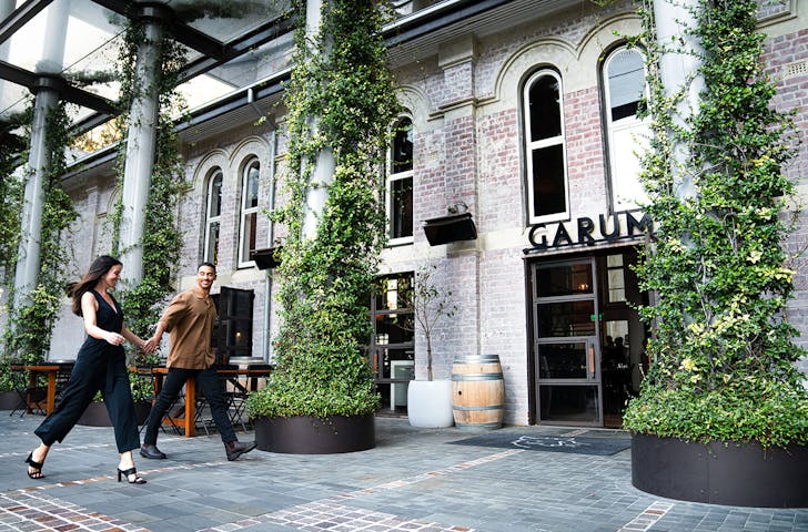 two people walking into a restaurant